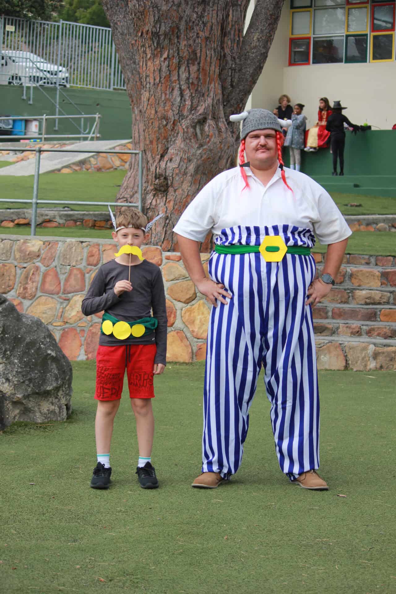A learner with a costumed character at a Camps Bay Primary dress-up event