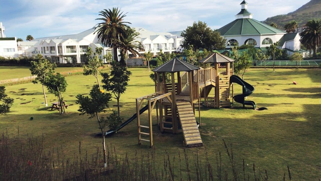 Wooden play equipment on the lawn at the Camps Bay Primary Grade R campus